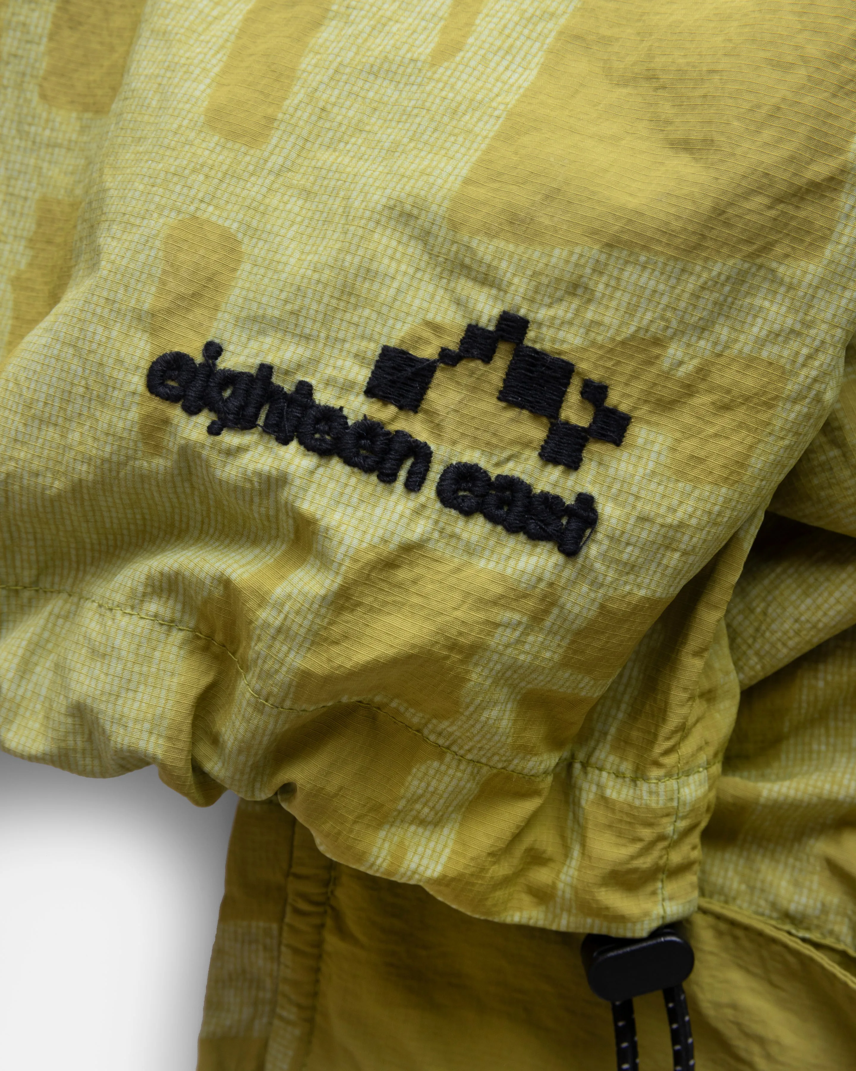CATA HOODED WINDBREAKER - IGUANA GREEN DISCHARGE PRINTED FEATHERWEIGHT MICRO RIPSTOP NYLON
